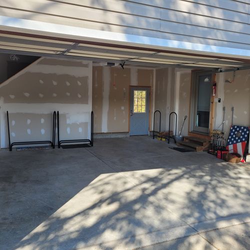 EXTERIOR:  Use of the rental includes use of the large 2-car garage.  Also includes use of the corn hole set, Bocci ball set, and croquet set that are shown in the photo.  Stairs up to the bunk room above the garage are at the back left of the photo.