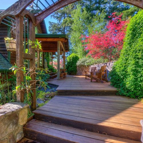 Gardens and decks meander through the back of the property