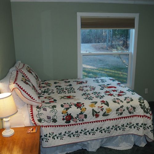 Bedroom #2:  another view of one of the two full-size beds along with the view from the bedroom window.