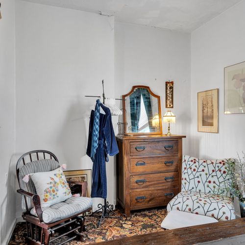 Eclectic bedroom full of local personality & one-of-a-kind charm.