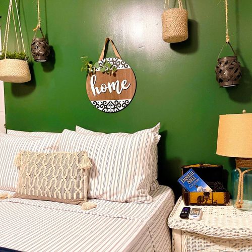 Stylish decor and a unique wall art add a touch of personality to this bedroom.