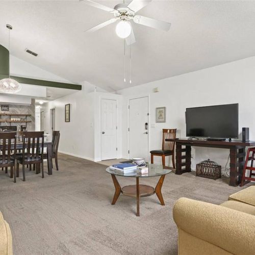 Living area with flat screen TV and dining table