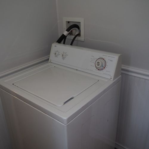 Laundry room:  just off of the kitchen, the home has a very convenient first-floor laundry room with a new washer and dryer!