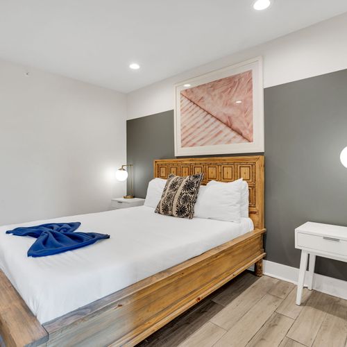 Soft tones & ambient lighting create a calm, relaxing bedroom retreat.