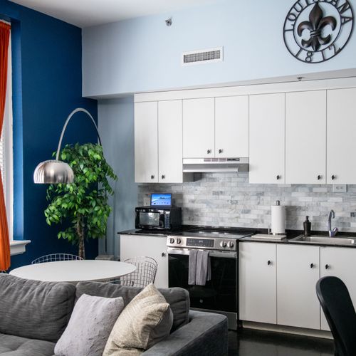 Sleek kitchen & open living space designed for easy mornings & laid-back evenings.