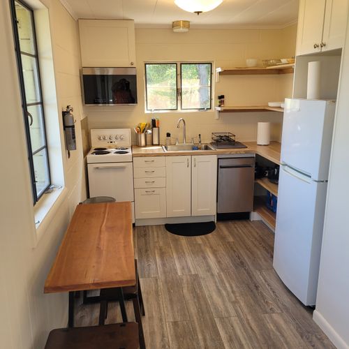 Kitchen:  the home has a very cute and newly updated kitchen with all appliances, including a dishwasher. Also includes a small breakfast nook with stools and a great view of crystal lake!