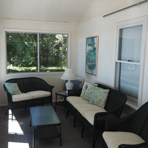 Porch:  the cottage has a beautiful enclosed porch with comfy seating and great views of the lake!