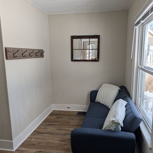 LIVING ROOM:  Very comfy and cozy living room with 2 sofas, a futon, a rocking chair, coffee table, new flooring, and new live streaming television.