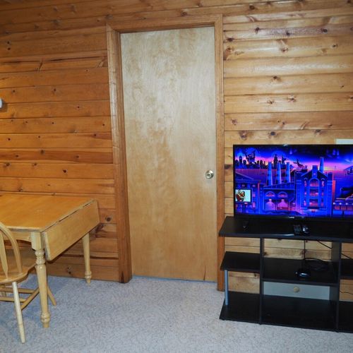 Bedroom #2 (second floor):  this is a huge upstairs bedroom with it's own television, desk, jetted tub, king-size bed, dresser, mirror, closet, and private en suite bathroom!