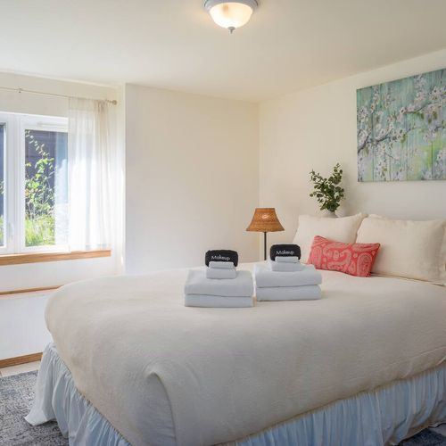 Guest Bedroom with garden views and quiet space set apart from the upstairs common area.