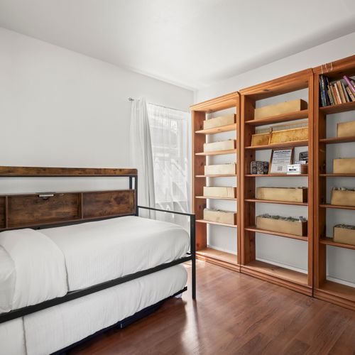 Warm wood tones add charm to this clean, comfy space.