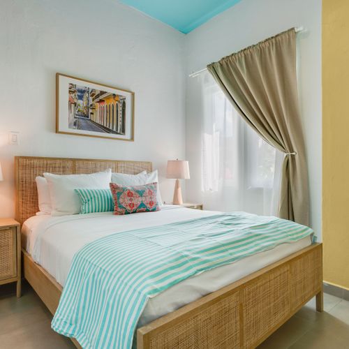A calm and serene room with a comfortable bed and soothing light.