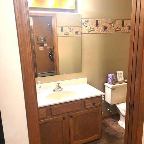 HALF-BATH (MAIN FLOOR):  There's a convenient half-bath located near the main entrance.