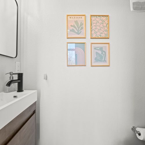 Convenient half bathroom located in the main living area.