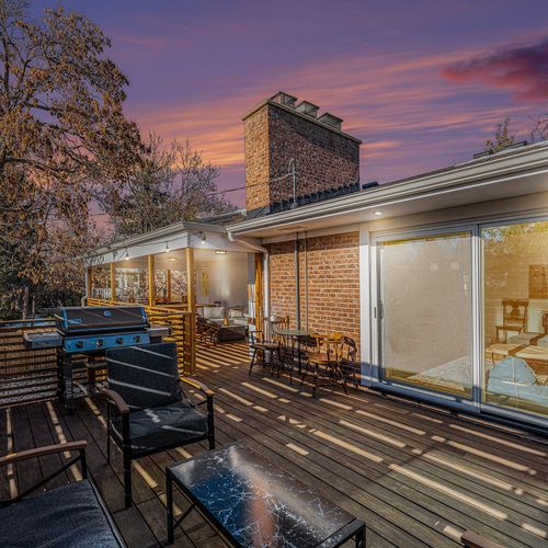 Additional cozy seating at the other end of the deck, providing plenty of space to relax and take in the surrounding views.