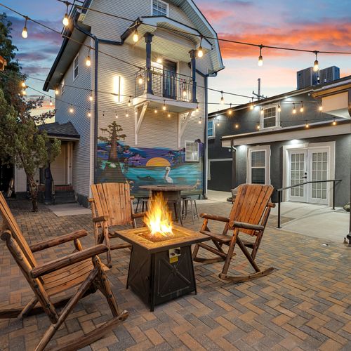 Unwind by the fire in these comfortable wooden rocking chairs as the New Orleans sunset paints the sky, creating the perfect setting for a memorable evening.