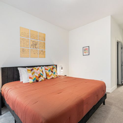 Stay in style in this modern, artfully decorated bedroom with its own ensuite bathroom.
