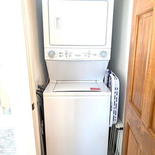 BATHROOM #2 (UPPER LEVEL):  The stacked washer and dryer that are in a laundry closet in the bedroom.