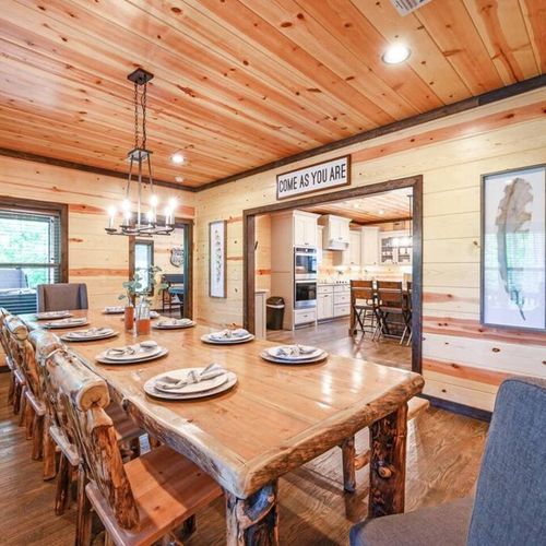 The formal dining table is set and ready for a meal to be enjoyed!