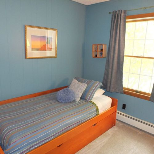 Bedroom #3:  features a trundle (i. E. 2 twin beds), a dresser, and a closet.