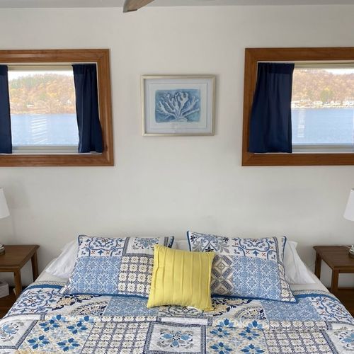 Bedroom #3 (second floor):  features a king-size bed, dresser, closet, ceiling fan, and great views of betsie lake!