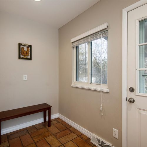 The kitchen naturally flows to a mud room and the covered patio space.