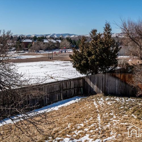 Take in the views of the nearby playground and lake from the huge fenced in backyard.
