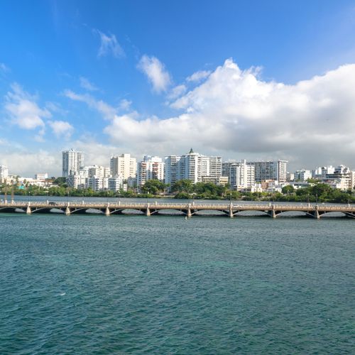 Immerse yourself in stunning waterfront views! Enjoy the vibrant San Juan skyline & serene Condado Lagoon from your doorstep