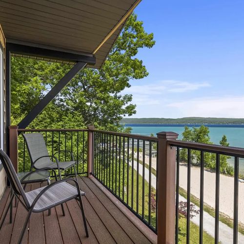 PRIMARY BEDROOM (UPPER LEVEL):  This is the private balcony for the primary bedroom, which features an incredible view of Crystal Lake from the balcony!