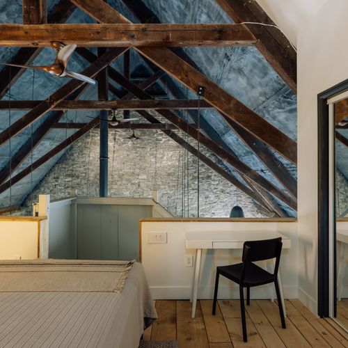 You'll be hard pressed to find a more unique place to rest your head than The Rifton's loft bedroom, tucked under the eaves of this 1876 church.