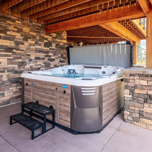 - unwind year round in the private hot tub tucked beneath a timber framed patio
- enjoy mountain air and bubbling jets surrounded by stone and wood finishes
- whether under stars or snowflakes, it’s the ultimate place to recharge and relax