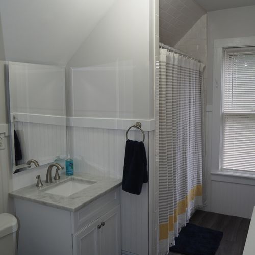 Bathroom #2 (upstairs):  there is a full bathroom upstairs with a combination bathtub / shower, toilet, vanity, sink, and mirror.