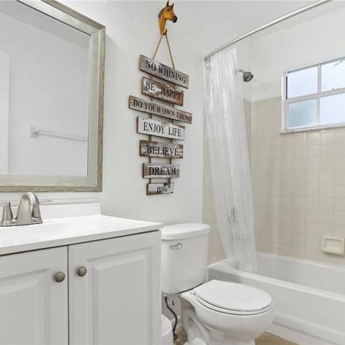 Full bathroom with combination of bath tub and shower