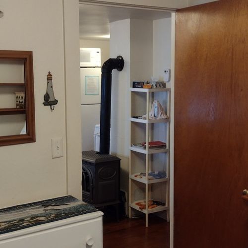 Bedroom #1:  features a full-size bed, nightstand, lamp, dresser. And closet.
