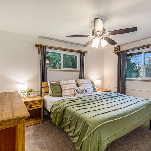 Bedroom designed with comfort first—spacious bed, warm lighting, serene vibe.