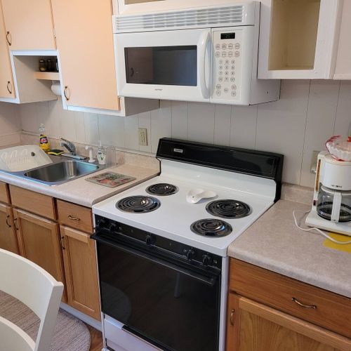 KITCHEN AND DINING AREA:  Full kitchen with a good supply of cooking and dining utensils.  Also includes dining area and washer and dryer.