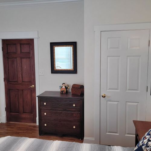 Bedroom #1 (main floor):  features a queen-size bed and its own private en suite full bathroom, dresser, nightstand, and closet.