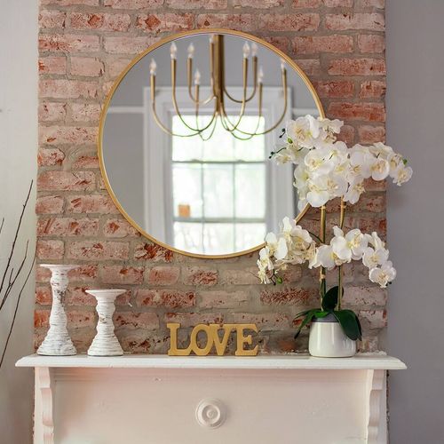 Elegant touch of 'LOVE' — this cozy mantel features soft florals and rustic exposed brick, reflecting the heart of New Orleans' charm.