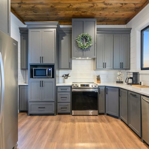 The kitchen is equipped with all of the stainless steel appliances you need!