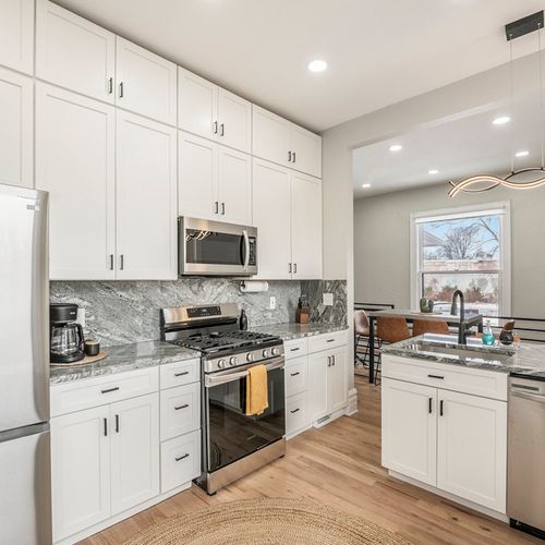 Discover the beauty of our kitchen, complete with sleek stainless steel appliances.