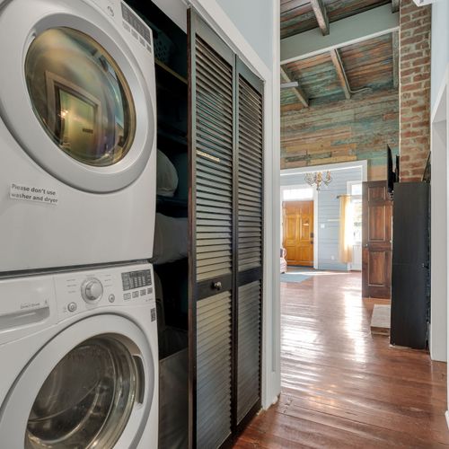 Stacked washer & dryer tucked away — laundry made easy during your stay.