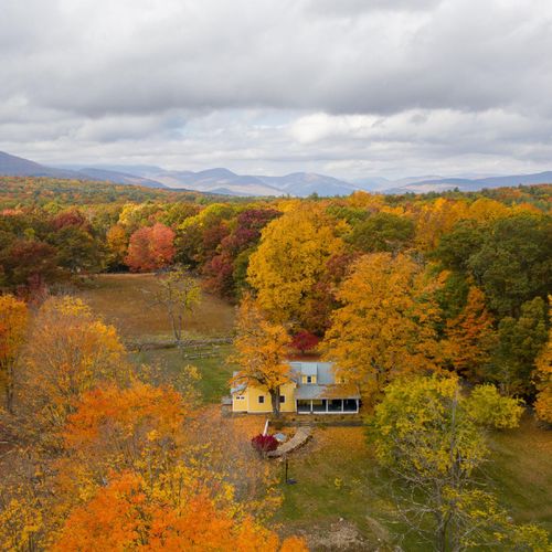 An aerial shot of White Tail Farmhouse. Fall is absolutely gorgeous here!