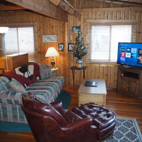 Overall:  the cute and cozy living room with live streaming television.