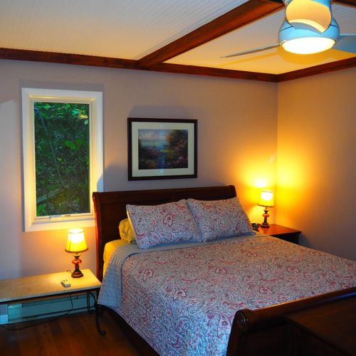 Bedroom #1 (second floor):  features a queen-size bed, nightstands, dresser, ceiling fan, closet, and a private entrance to the second floor bathroom.