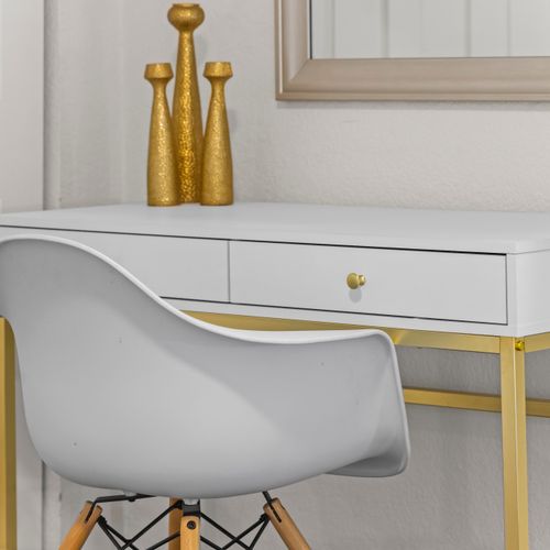 Get work done comfortably at the cozy desk and chair workspace.