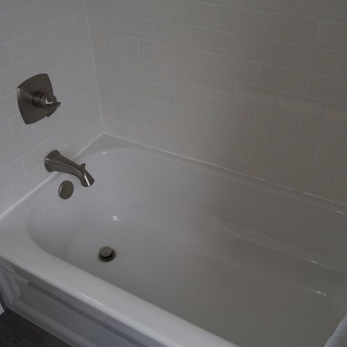 Bathroom #2 (upstairs):  there is a full bathroom upstairs with a combination bathtub / shower, toilet, vanity, sink, and mirror.