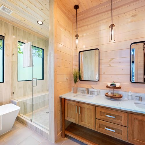 Relax and unwind in a serene retreat featuring a modern soaking tub!
