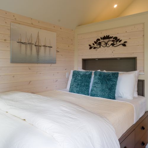 A calm, inviting bedroom that feels like a warm hug after a long day of exploring, soft bedding, plush pillows, and peaceful touches all around.