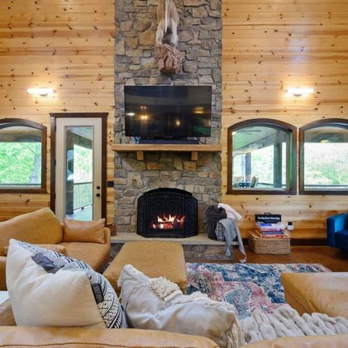 The heart of the main living area is the gas fireplace and smart tv.