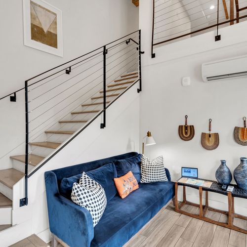 Bright and stylish loft living with local artwork, cozy seating, and all the comforts of home.